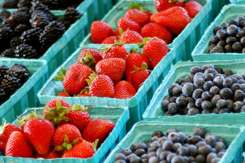 Cartons of strawberries and blueberries