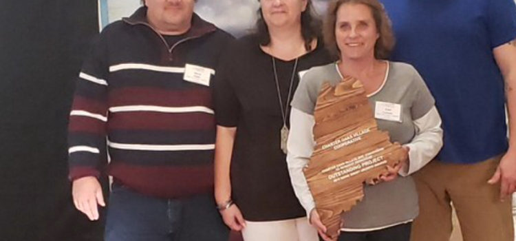 From left to right: Charter Oaks Village residents Steve Staples, Shannon Staples, Ann Lantagne, Marcus Baldwin at GrowSmart Summit holding their 2019 Smart Growth Award