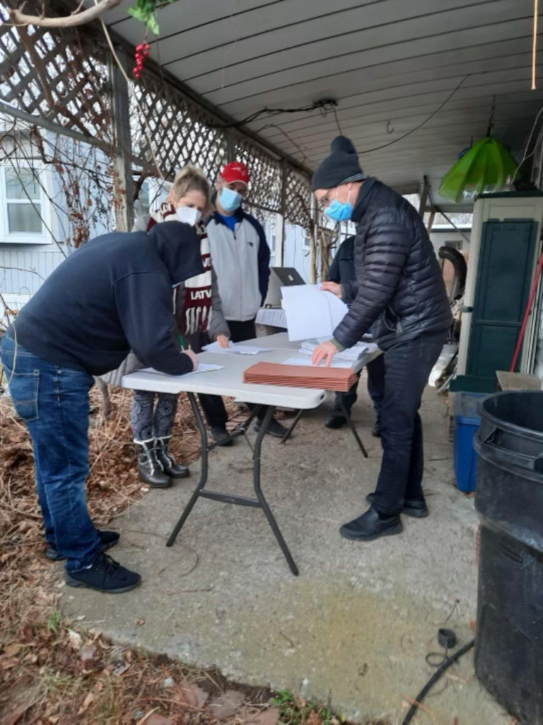 North Street Association residents signing closing documents for property, December 29, 2021